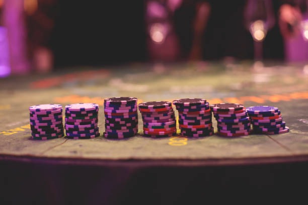 Live dealer studio with Ways of the Qilin game board featuring Asian symbols and HD camera setup